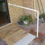 Photo of handrail, timber ramp and checkerplate end